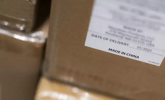 A "Made in China" sticker is seen on inventory at the baby store Three Littles Union Market location in Washington, on Wednesday, April 16, 2025. (AP Photo/Nathan Howard)