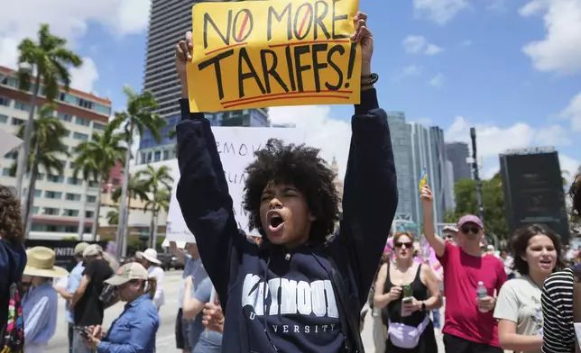 Paul Ivanov chants slogans during a protest against the Trump administration, Saturday, April 19, 2025, in Miami. (AP Photo/Lynne Sladky)