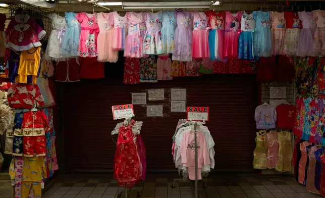 Clothes sit for sale at a shopping market in the Chinatown neighborhood of Los Angeles, Monday, April 21, 2025. (AP Photo/Andy Bao)