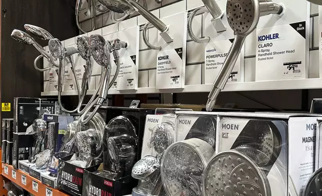 Shower heads on display at a Home Depot store Thursday, April 17, 2025, in Orlando, Fla. (AP Photo/John Raoux)