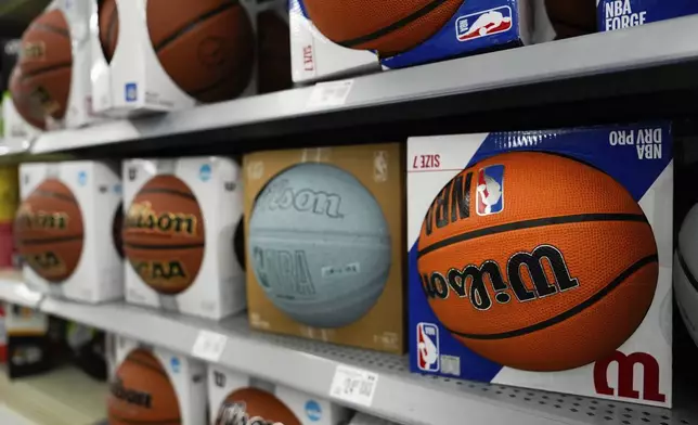 Basketballs are displayed on shelves at a Walmart, Wednesday, April 16, 2025, in Groton, Conn. (AP Photo/Julia Demaree Nikhinson)