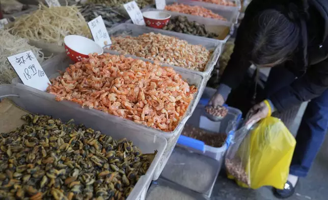 Dry foods are displayed at a market in Chinatown in San Francisco, Friday, April 18, 2025. (AP Photo/Jeff Chiu)