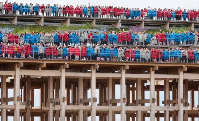 Participants sing Beethoven's "Ode to Joy" on the opening day of Osaka Expo 2025 in Osaka, western Japan, Sunday, April 13, 2025. (AP Photo/Hiro Komae)