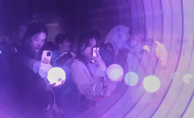 People visit the pavilion of the Philippines on the opening day of the Expo 2025 in Osaka, central Japan, Sunday, April 13, 2025. (AP Photo/Hiro Komae)