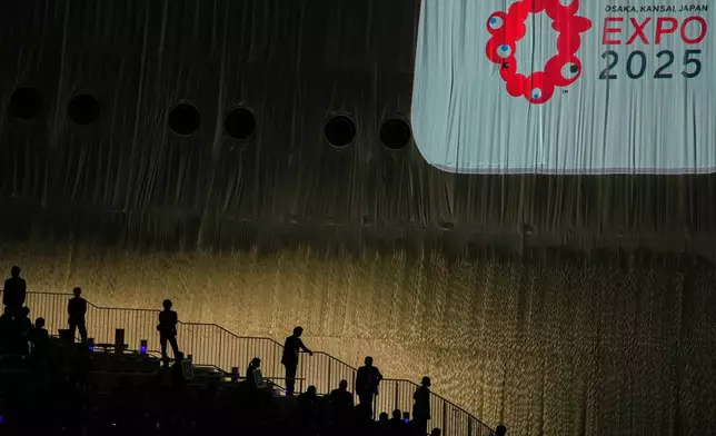 Security guards stand at the venue of the opening ceremony of the World Expo in Osaka, central Japan, Saturday, April 12, 2025. (AP Photo/Hiro Komae)