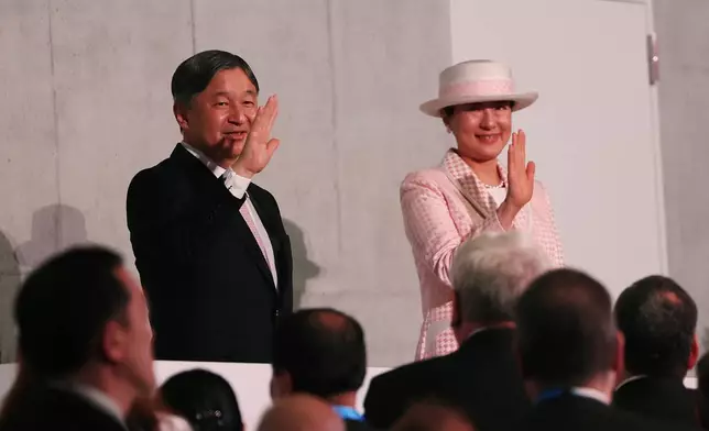 Japan's Emperor Naruhito and Empress Masako wave after the opening ceremony of the Osaka Expo 2025 in Osaka, western Japan Saturday, April 12, 2025. (Jia Haocheng/Pool Photo via AP)