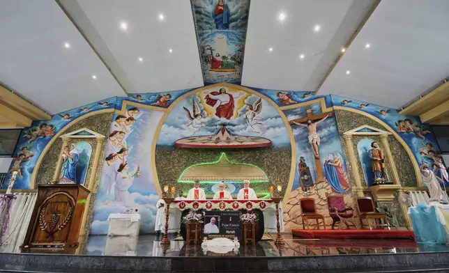 Catholic priests hold a requiem Mass for the late Pope Francis at a church in Guwahati, India, Tuesday, April 22, 2025. (AP Photo/Anupam Nath)