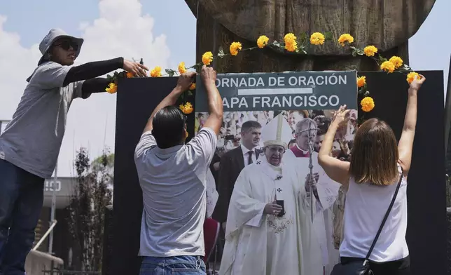 Workers prepare an altar for the late Pope Francis at the Basilica of Guadalupe in Mexico City, Monday, April 21, 2025. (AP Photo/Fernando Llano)