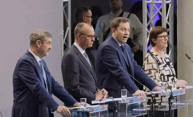 Markus Soeder, chairman of Bavarian¥s Christian Social Union party, Friedrich Merz, Christian Democratic Union party chairman and the Social Democratic Party co-leaders Lars Klingbeil and Saskia Esken, brief the media after reaching an agreement between their parties on a coalition for a new German government at a news conference in Berlin, Germany, Wednesday, April 9, 2025. (AP Photo/Markus Schreiber)