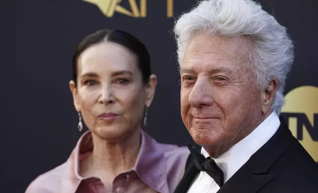 Lisa Hoffman, left, and Dustin Hoffman arrive at the 50th AFI Life Achievement Award tribute to Francis Ford Coppola on Saturday, April 26, 2025, at the Dolby Theatre in Los Angeles. (Photo by Jordan Strauss/Invision/AP)