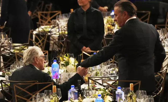 Actors Robert De Niro, left, and Andy Garcia mingle before the 50th AFI Life Achievement Award tribute to Francis Ford Coppola on Saturday, April 26, 2025, at the Dolby Theatre in Los Angeles. (AP Photo/Chris Pizzello)