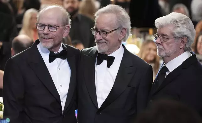 Filmmakers Ron Howard, left, Steven Spielberg, center, and George Lucas pose together during the 50th AFI Life Achievement Award tribute to Francis Ford Coppola on Saturday, April 26, 2025, at the Dolby Theatre in Los Angeles. (AP Photo/Chris Pizzello)