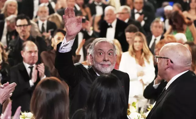 Filmmaker Francis Ford Coppola waves to the audience upon arriving at the 50th AFI Life Achievement Award tribute to him on Saturday, April 26, 2025, at the Dolby Theatre in Los Angeles. (AP Photo/Chris Pizzello)