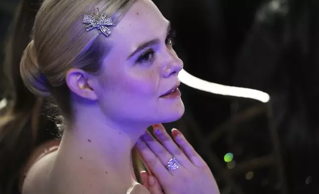 Actor Elle Fanning listens in the audience during the 50th AFI Life Achievement Award tribute to Francis Ford Coppola on Saturday, April 26, 2025, at the Dolby Theatre in Los Angeles. (AP Photo/Chris Pizzello)