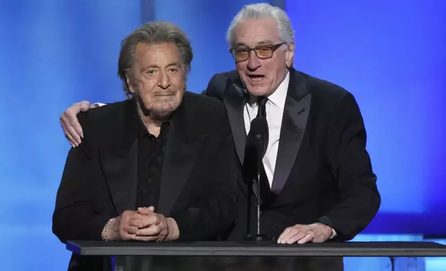 Actors Al Pacino, left, and Robert De Niro address the audience during the 50th AFI Life Achievement Award tribute to Francis Ford Coppola on Saturday, April 26, 2025, at the Dolby Theatre in Los Angeles. (AP Photo/Chris Pizzello)