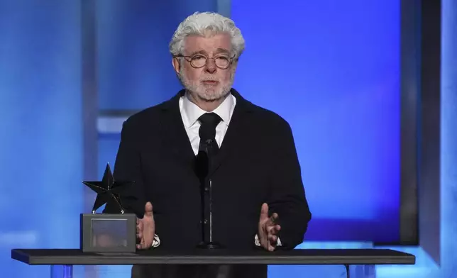 Filmmaker George Lucas speaks from the stage during the 50th AFI Life Achievement Award tribute to Francis Ford Coppola on Saturday, April 26, 2025, at the Dolby Theatre in Los Angeles. (AP Photo/Chris Pizzello)