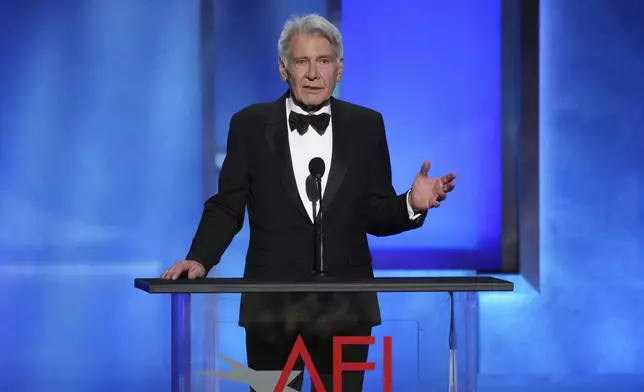 Actor Harrison Ford addresses the audience during the 50th AFI Life Achievement Award tribute to Francis Ford Coppola on Saturday, April 26, 2025, at the Dolby Theatre in Los Angeles. (AP Photo/Chris Pizzello)