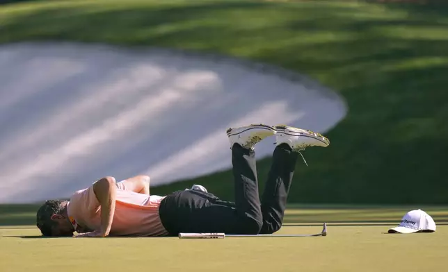 Justin Rose reacts after missing an eagle putt on the 13th hole during the final round at the Masters golf tournament, Sunday, April 13, 2025, in Augusta, Ga. (AP Photo/Julia Demaree Nikhinson)