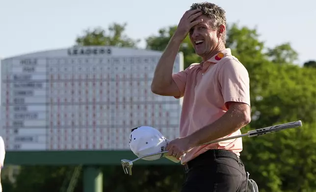 Justin Rose celebrates after a birdie on the 18th hole during the final round at the Masters golf tournament, Sunday, April 13, 2025, in Augusta, Ga. (AP Photo/David J. Phillip)