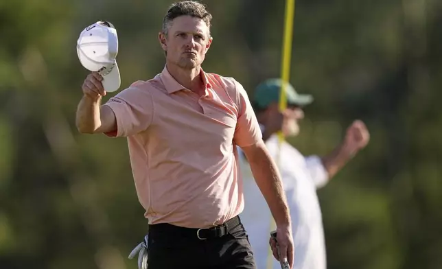 Justin Rose celebrates after a birdie on the 18th hole during the final round at the Masters golf tournament, Sunday, April 13, 2025, in Augusta, Ga. (AP Photo/David J. Phillip)