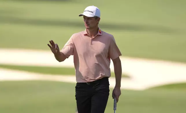 Justin Rose waves after making a putt on the 10th hole during the final round at the Masters golf tournament, Sunday, April 13, 2025, in Augusta, Ga. (AP Photo/Matt Slocum)
