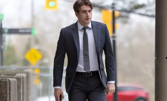 Michael McLeod, one of five members of Canada’s 2018 world junior hockey team charged with sexual assault last year for an incident that allegedly took place in June 2018, arrives at the London Courthouse in London, Ontario, Wednesday, April 23, 2025. (Nicole Osborne/The Canadian Press via AP)