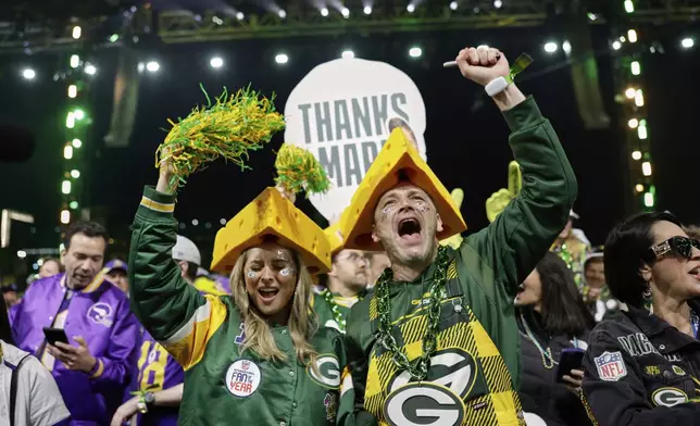 Green Bay Packers fans celebrates during the first round of the NFL football draft, Thursday, April 24, 2025, in Green Bay, Wis. (AP Photo/Matt Ludtke)