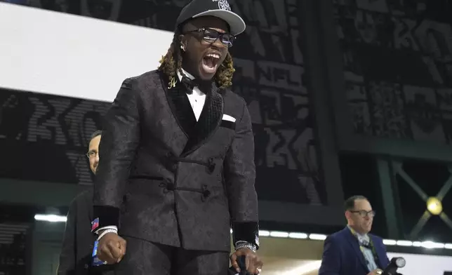 Boise State running back Ashton Jeanty celebrates after being chosen by the Las Vegas Raiders with the sixth overall pick during the first round of the NFL football draft, Thursday, April 24, 2025, in Green Bay, Wis. (AP Photo/Jeff Roberson)