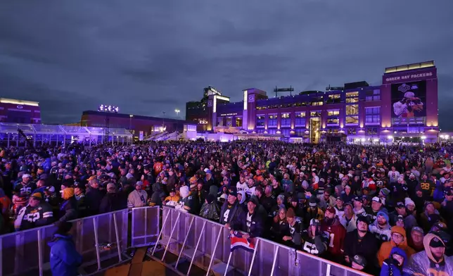 Fans watch during the second round of the NFL football draft, Friday, April 25, 2025, in Green Bay, Wis. (AP Photo/Matt Ludtke)