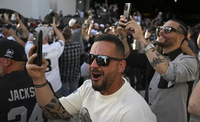Fans react to the Las Vegas Raiders' pick during the Raiders NFL football draft party Thursday, April 24, 2025, in Las Vegas. (AP Photo/Candice Ward)