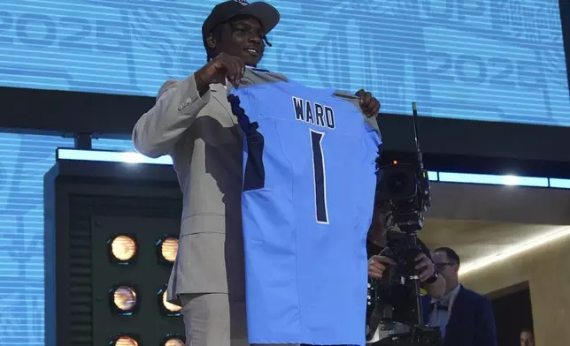 Miami quarterback Cam Ward poses after being chosen by the Tennessee Titans with the first overall pick during the first round of the NFL football draft, Thursday, April 24, 2025, in Green Bay, Wis. (AP Photo/Jeff Roberson)