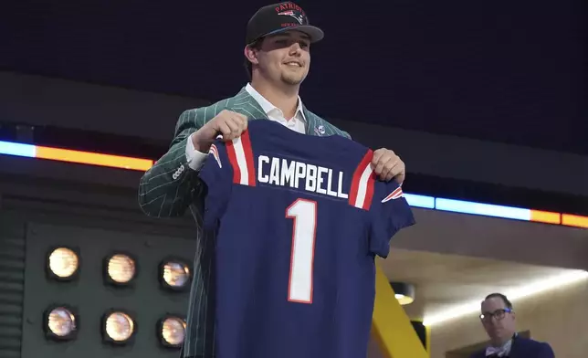 LSU offensive tackle Will Campbell poses after being chosen by the New England Patriots with the fourth overall pick during the first round of the NFL football draft, Thursday, April 24, 2025, in Green Bay, Wis. (AP Photo/Jeff Roberson)