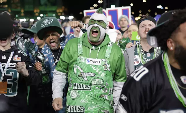 Philadelphia Eagles fans cheer during the second round of the NFL football draft, Friday, April 25, 2025, in Green Bay, Wis. (AP Photo/Matt Ludtke)