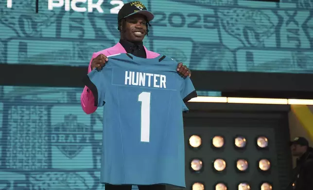 Colorado wide receiver Travis Hunter poses after being chosen by the Jacksonville Jaguars with the second overall pick during the first round of the NFL football draft, Thursday, April 24, 2025, in Green Bay, Wis. (AP Photo/Jeff Roberson)