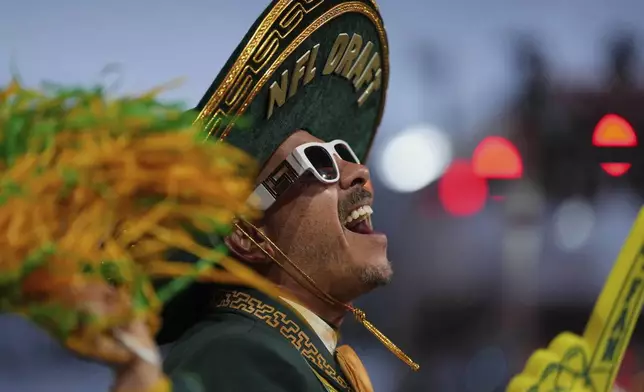 A Green Bay Packers fan cheers during the second round of the NFL football draft, Friday, April 25, 2025, in Green Bay, Wis. (AP Photo/Jeff Roberson)