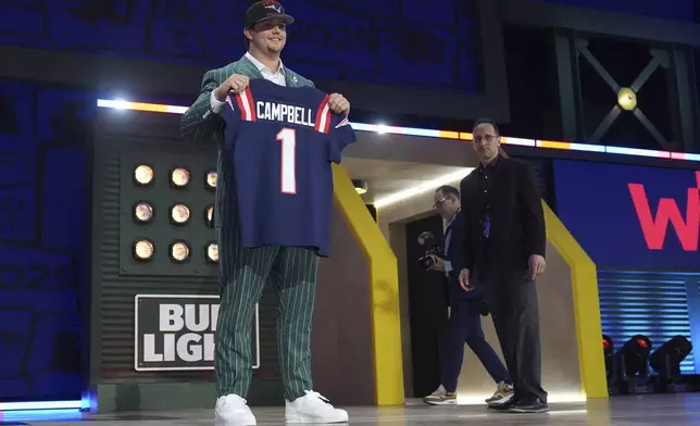 LSU offensive tackle Will Campbell poses after being chosen by the New England Patriots with the fourth overall pick during the first round of the NFL football draft, Thursday, April 24, 2025, in Green Bay, Wis. (AP Photo/Jeff Roberson)