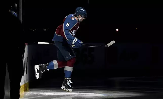 Colorado Avalanche defenseman Cale Makar (8) takes to the ice prior to the first period of an NHL hockey game against the Vegas Golden Knights Tuesday, April 8, 2025, in Denver. (AP Photo/Geneva Heffernan)