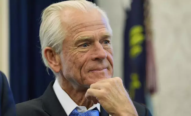 White House trade adviser Peter Navarro listens as President Donald Trump speaks as he signs executive orders in the Oval Office of the White House, Thursday, April 17, 2025, in Washington. (AP Photo/Alex Brandon)