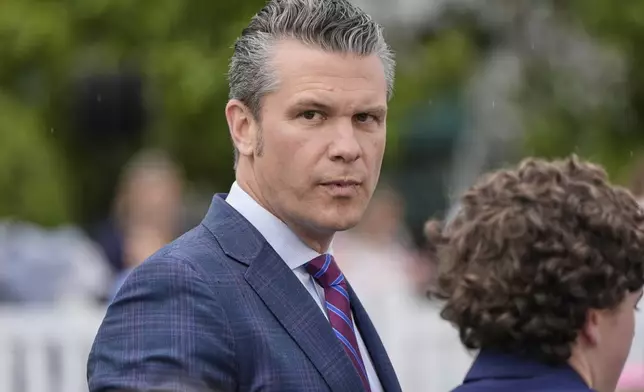 Defense Secretary Pete Hegseth arrives on the South Lawn of the White House before President Donald Trump and first lady Melania Trump participate in the White House Easter Egg Roll Monday, April 21, 2025, in Washington. (AP Photo/Alex Brandon)