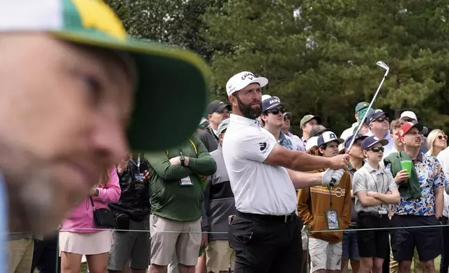 Jon Rahm, of Spain, watches his tee shot on the fourth hole during a practice around at the Masters golf tournament, Wednesday, April 9, 2025, in Augusta, Ga. (AP Photo/Ashley Landis)