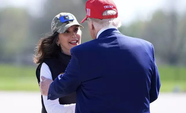 President Donald Trump greets Michigan Gov. Gretchen Whitmer as he arrives on Air Force One at Selfridge Air National Guard Base, Tuesday, April 29, 2025, in Harrison Township, Mich. (AP Photo/Alex Brandon)