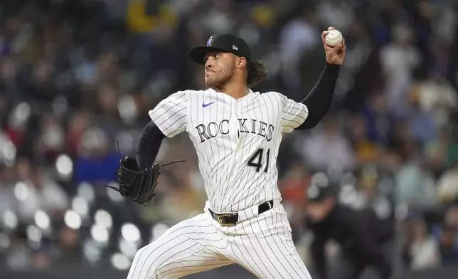Colorado Rockies relief pitcher Luis Peralta works against the Milwaukee Brewers in the fifth inning of a baseball game Wednesday, April 9, 2025, in Denver. (AP Photo/David Zalubowski)