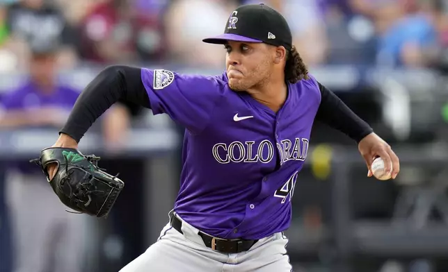 Colorado Rockies pitcher Luis Peralta (41) delivers to the Tampa Bay Rays during the fifth inning of a baseball game Saturday, March 29, 2025, in Tampa, Fla. (AP Photo/Chris O'Meara)