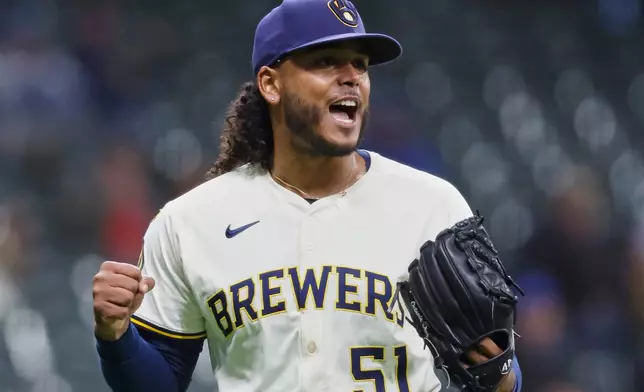 Milwaukee Brewers pitcher Freddy Peralta (51) reacts at the end of the seventh inning of a baseball game against the Kansas City Royals, Wednesday, April 2, 2025, in Milwaukee. (AP Photo/Jeffrey Phelps)