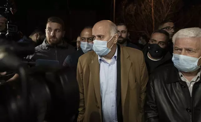 FILE - Senior Fatah official Jibril Rajoub, center, arrives at the Palestinian Central Election Commission office in the West Bank city of Ramallah on March 31, 2021, to register for a parliamentary election. (AP Photo/Nasser Nasser, File)