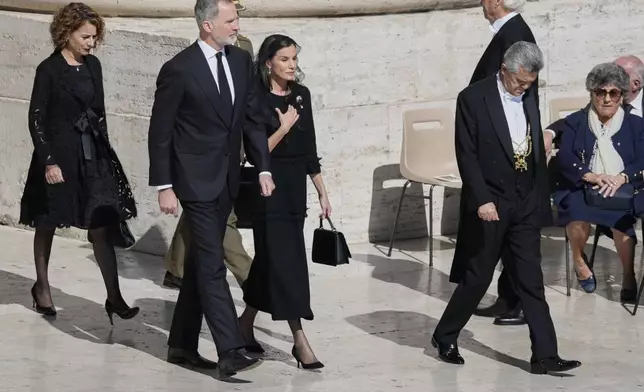 Spain's King Felipe VI and Queen Letizia, center, arrive for the funeral of Pope Francis in St. Peter's Square at the Vatican, Saturday, April 26, 2025. (AP Photo/Gregorio Borgia)
