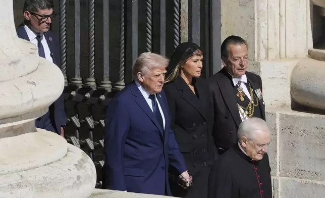 President Donald Trump and first lady Melania Trump arrive for the funeral of Pope Francis in St. Peter's Square at the Vatican, Saturday, April 26, 2025. (AP Photo/Markus Schreiber)