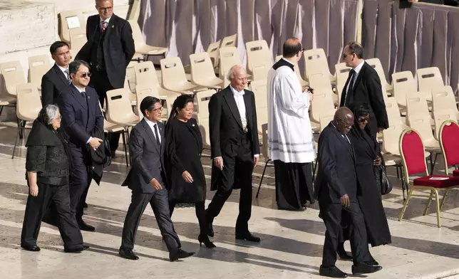 Philippines President Ferdinand Marcos Jr, center left, and his wife Louise arrive for the funeral of Pope Francis in St. Peter's Square at the Vatican, Saturday, April 26, 2025. (AP Photo/Markus Schreiber)