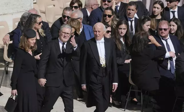 British Prime Minister Keir Starmer, center left, arrives for the funeral of Pope Francis in St. Peter's Square at the Vatican, Saturday, April 26, 2025. (AP Photo/Markus Schreiber)