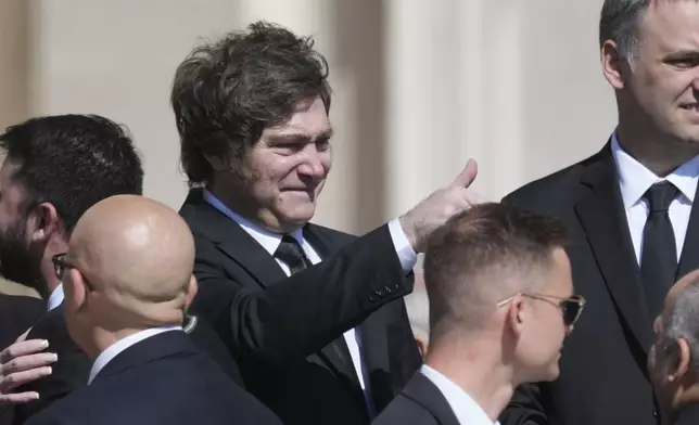 Argentina's President Javier Milei gestures as he arrives for the funeral of Pope Francis in St. Peter's Square at the Vatican, Saturday, April 26, 2025. (AP Photo/Alessandra Tarantino)